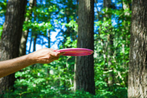 istock Hand Holding a Pink Disc Golf Flying Disc 2162434882