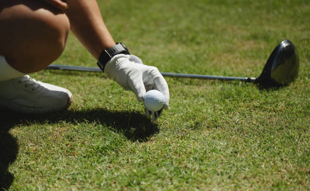 istock Golfer prepares to tee off on sunny day 2162438657