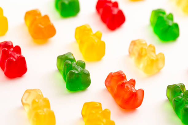 istock Rainbow Colored Bear Shaped Gummy Candies Isolated on a White Background 2162439110