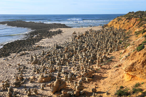 Round stacked stones on the shore in Vilanova de Milfontes