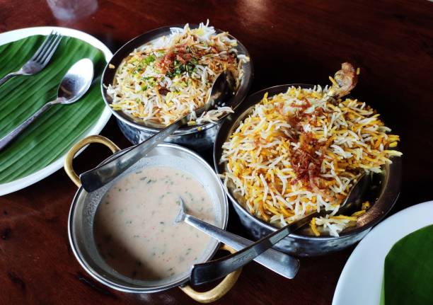 istock Indian cuisine - Kolkata biryani made with basmati rice with a chicken run, boiled egg and a whole potato. 2162441778
