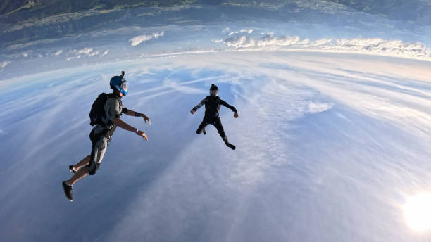 Freefall jumpers face each other mid-air