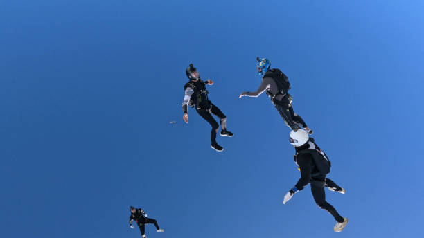 istock Freefall jumpers perform moves mid-air 2162443704