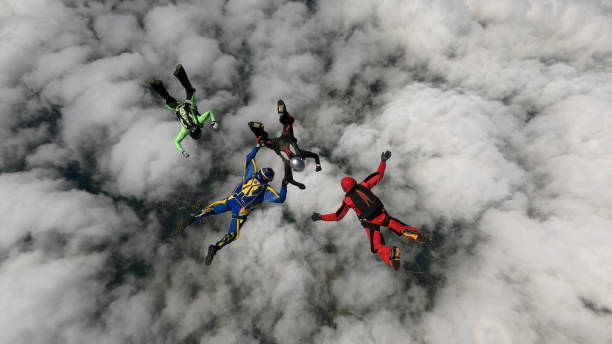 istock Freefall jumpers hold hands mid-air 2162443783