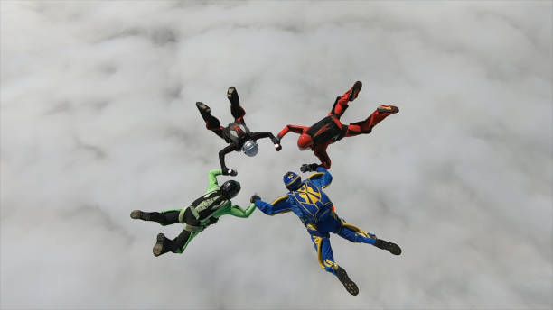 istock Freefall jumpers hold hands mid-air 2162443806