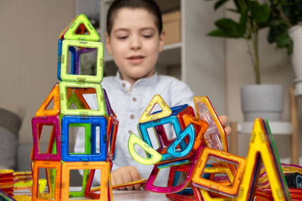 istock A child plays with a magnetic construction set. Interesting educational toys. 2162447113