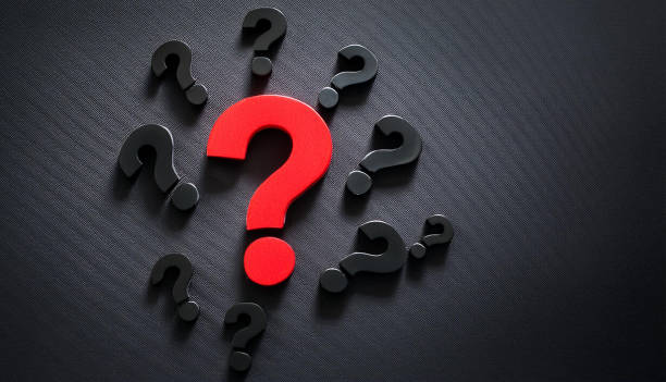 istock FAQ banner design. Red question mark surrounded by black question marks on dark background. 3D rendering. 2162447885