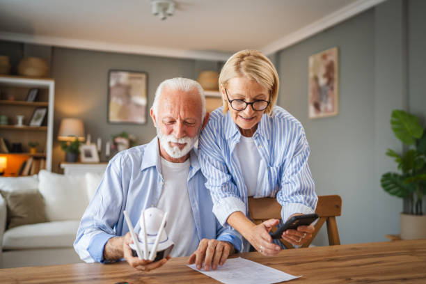 istock senior couple connect, adjust cctv security surveillance camera 2162453764
