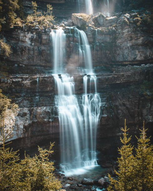 Enchanted waterfalls in a forest, Dolomites, Italy