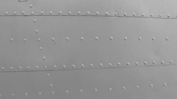 istock Sheet metal with rivets, aircraft fuselage texture. 2162461091