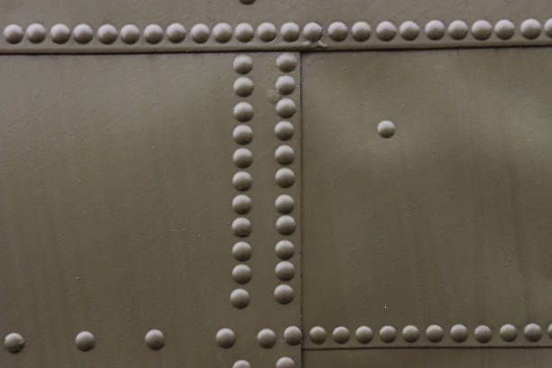 Riveted painted metal background texture.
