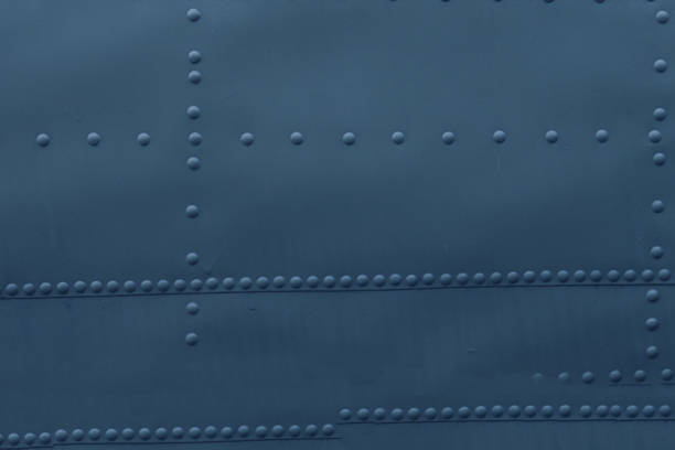 istock Photo of a metal surface with rivets. 2162461180