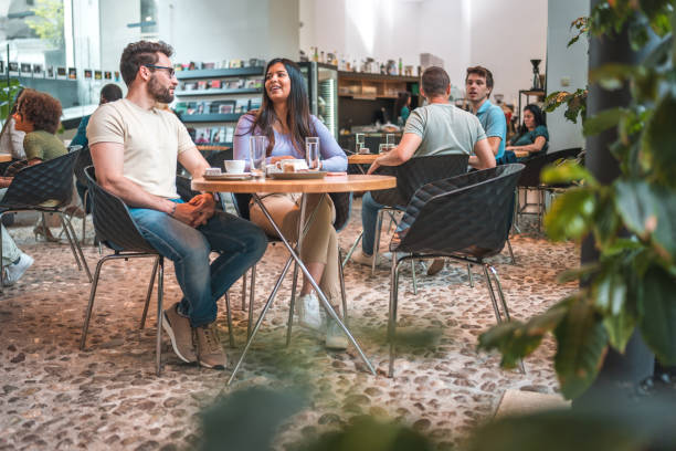 istock Beautifully Relaxed: Hispanic Couple in a Modern Cafe 2162461799