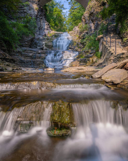 istock Beautiful cascading waterfall surrounded by lush greenery. Cascadilla Gorge in Ithaca New York 2162463156