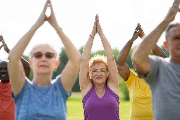 istock Seniors Outdoor Yoga Class 2162469576