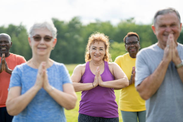 istock Seniors Outdoor Yoga Class 2162469589