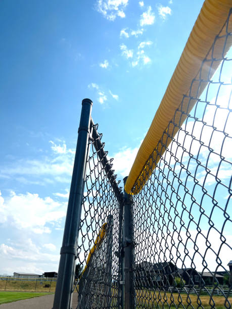 istock baseball field on sunny day with clouds and empty space 2162471917
