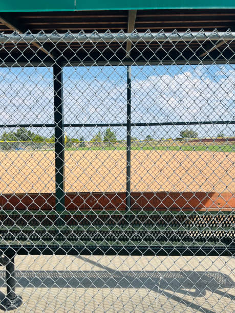 istock baseball field on sunny day with clouds and empty space 2162471933