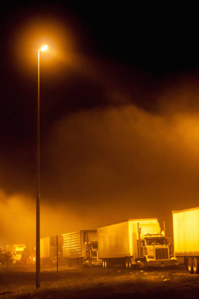 istock Trucks at the road side at night 2162472900