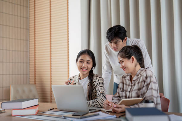 istock Group of Student Collaborationon a Project with a Laptop in a Modern Study Space 2162473111