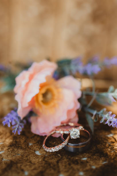 istock Wedding rings with colorful floral background 2162480038