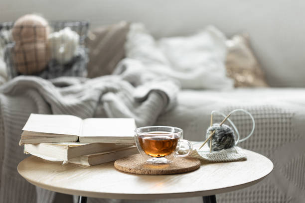 istock Cozy composition with a cup of tea, a candle and knitted elements. 2162480042