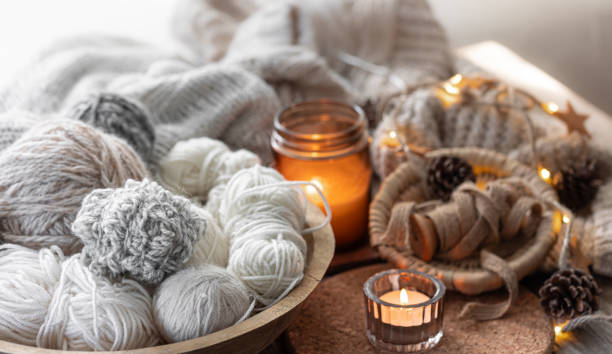 istock A cozy composition with threads, a candle . Hobby and home comfort concept. 2162480343