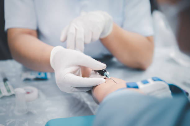 istock taking blood sample from a patient in the hospital. 2162481342