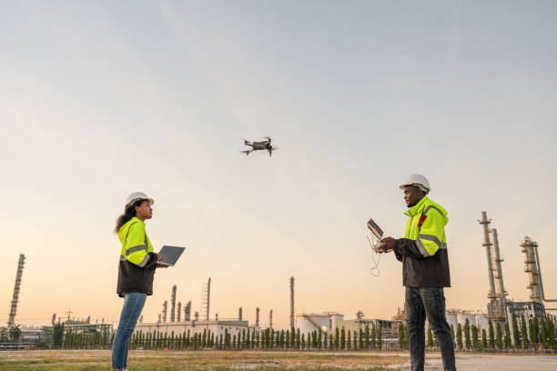 istock Team of Engineer Specialists Pilot Drone on Construction Site. 2162483176