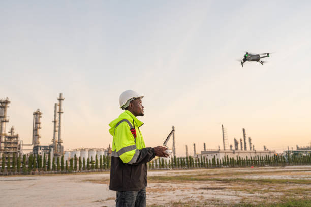 istock Team of Engineer Specialists Pilot Drone on Construction Site. 2162483191
