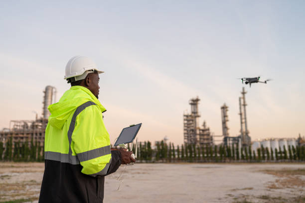 istock Team of Engineer Specialists Pilot Drone on Construction Site. 2162483194