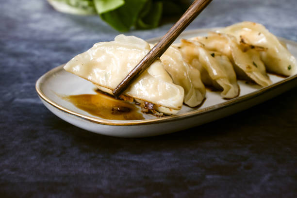 istock Fried Gyoza dumplings with soy sauce 2162483800