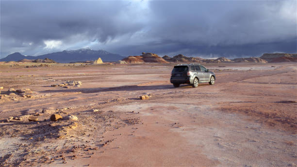 A SUV at the martian landscape near Hanksville, Utah