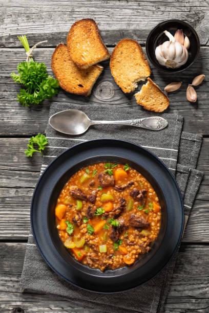 istock beef barley soup in a bowl, top view 2162488397