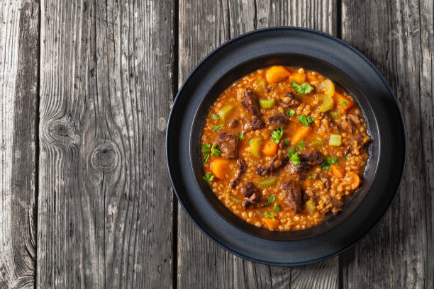 istock beef barley soup in a bowl, top view 2162488398
