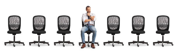 istock Worried professional man and many empty office chairs 2162488585
