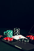 red-and-black-casino-chips-on-a-table-with-a-laptop-and-playing-cards.jpg?b=1&s=170x170&k=20&c=Ou5D9BgBiO_Bb--YrWo2U4twKFd8KDxFf8v_D5EIV30=