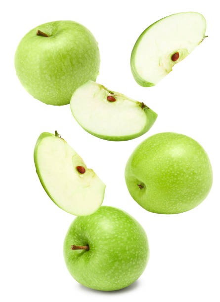 istock flying green apples with slices isolated on a white background. clipping path 2162489389