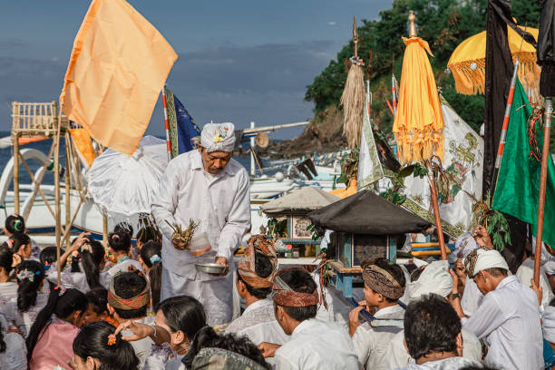 Barong Ket and 2 Rangda - traditional spirits of Bali island at temple ceremony Melasti before Balinese New Year and silence day Nyepi. Barong and Rangda masks have a canonical design of Balinese hinduism the same for all masks on the island and are not subject to copyright protection.  Holidays, festivals, rituals, art, culture of Indonesian people.