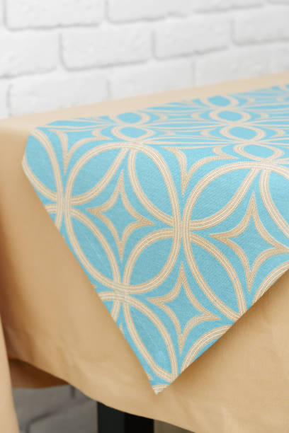 istock Beige Tablecloth on Wooden Table With White Brick Wall Background 2162491205