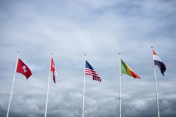 istock international flags on cloudy sky background 2162494272