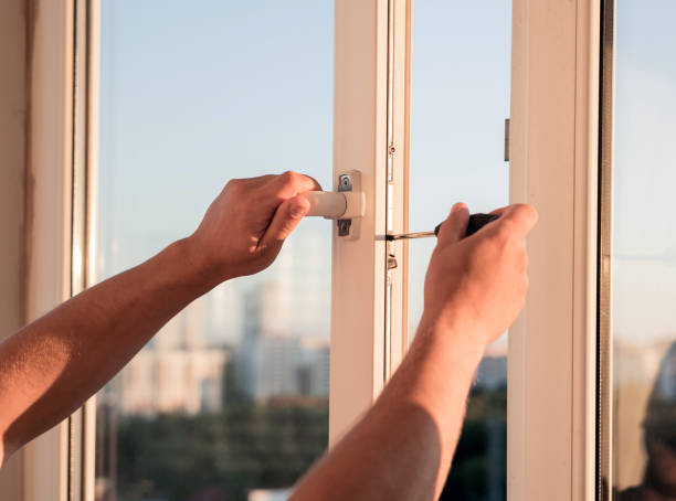 istock Handyman repairing the window 2162497584