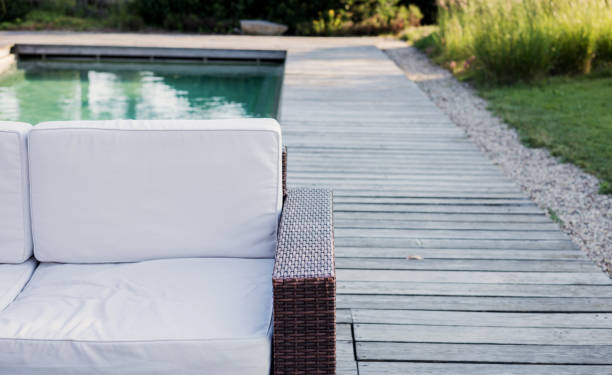 istock wicker couch for relaxing near swimming pool 2162497611