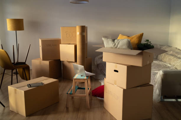 istock Room with cardboard boxes - moving in 2162498829