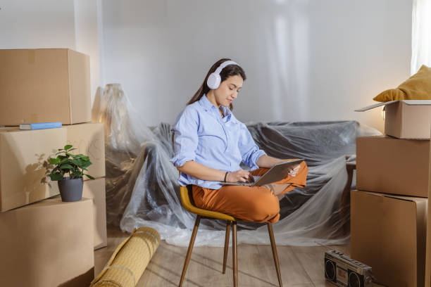 istock Working on laptop in my new home 2162498893