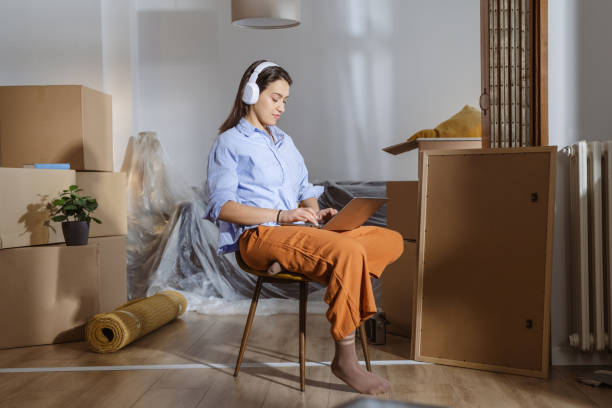 istock Working on laptop in my new home 2162498992