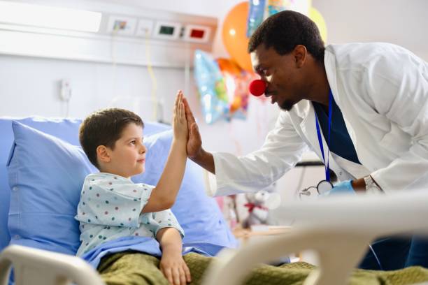 istock Doctor throws a high-five and relaxes his little patient 2162505519