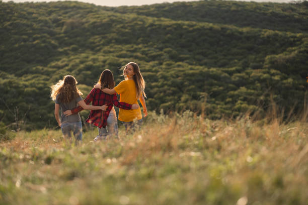 istock Happy girls walking on a mountain 2162507893