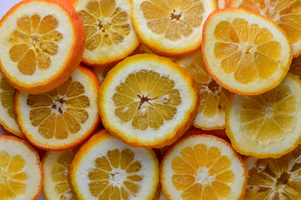 istock juicy oranges cut into circles as a background 4 2162508328