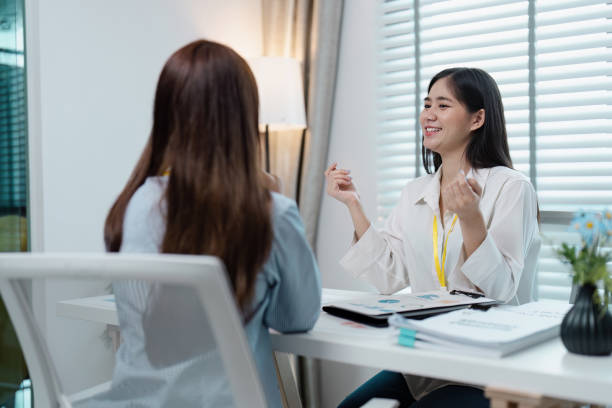 istock Professional Business Meeting in Modern Office with Two Women Discussing Documents and Ideas 2162509721